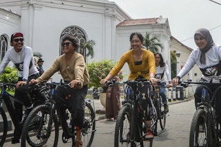 Cyclists on the road to Bali
