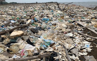 A beach strewn with plastic waste in Indonesia.