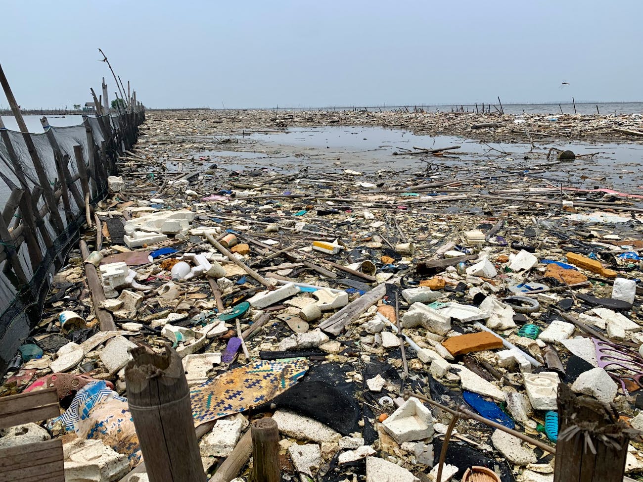 Plastic waste clogging a beach head in Jakarta