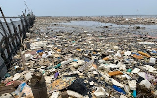 Plastic waste clogging a beach head in Jakarta