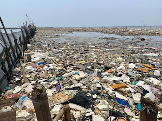 Plastic waste clogging a beach head in Jakarta