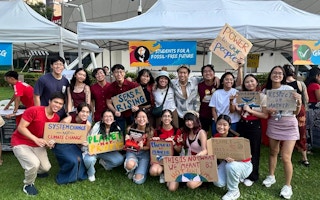 Supporters of Students for a Fossil Free Future gather at a rally to call for accelerated climate action in Singapore