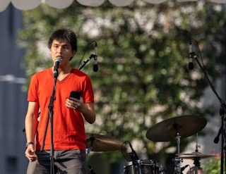 Ho Xiang Tian delivering a speech at a climate rally in Singapore in September 2023.