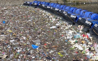 A Sungai Watch river barrier in Indonesia. One quarter of all PET bottles chucked into Indonesian rivers are Aqua branded. Image: Sungai Watch