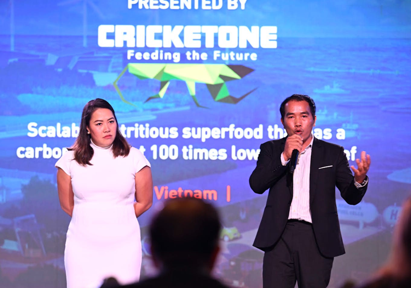 Bicky Nguyen (left) and Nam Dang from Cricket One argue the case for their solution to the judges at The Liveability Challenge 2024. Image: Eco-Business