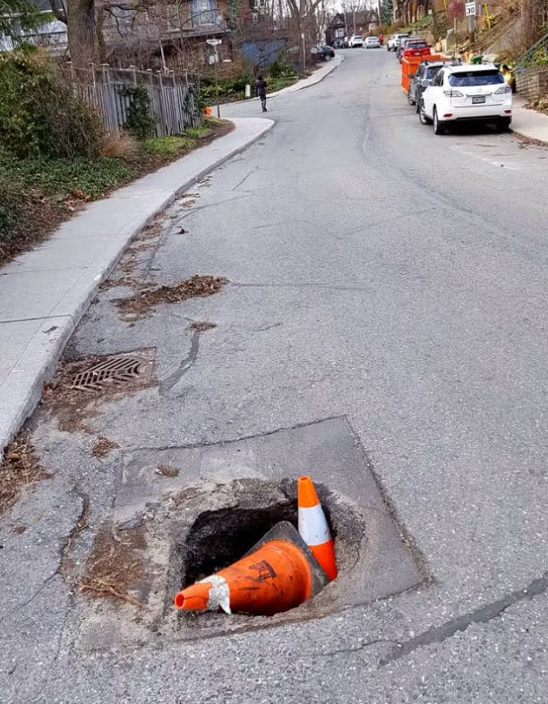 A pothole in a road