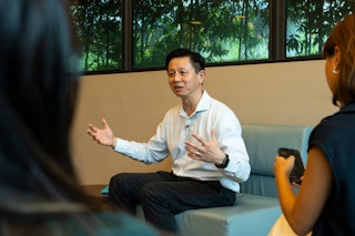 Singapore government chief sustainability officer Lim Tuang Liang speaking with journalists
