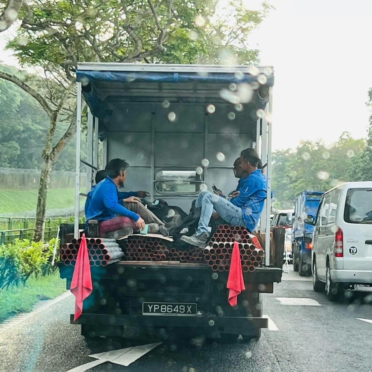 Workers in Singapore lorry