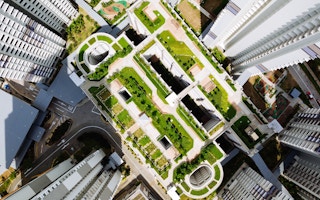 Green building in urban setting; aerial