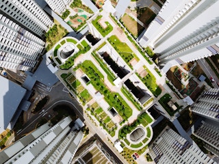 Green building in urban setting; aerial
