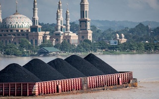 coal barge on the Mahakam River in Samarinda, East Kalimantan, Indonesia