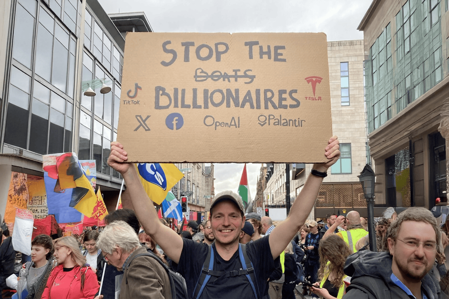 A demonstrator in Glasgow agitates to tax the super rich