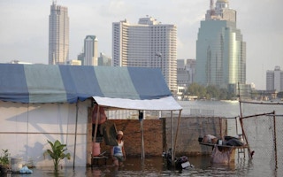 man in flooded home in BKK