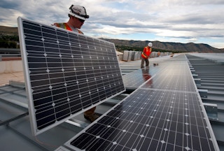 workers installing solar panel1