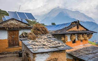Nepali traditional houses with solar panel roofs