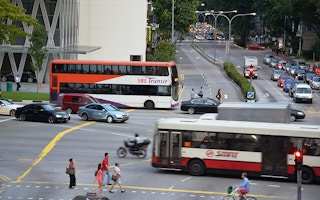 singapore road with commuters