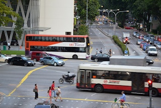 singapore road with commuters