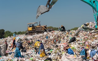Scavengers pick through garbage collected at a landfill site in Thailand.