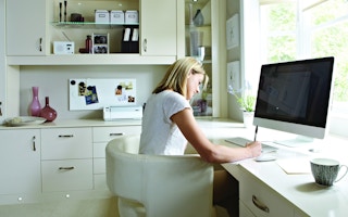 A woman working from her home office