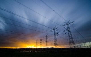 dawn over power lines in australia