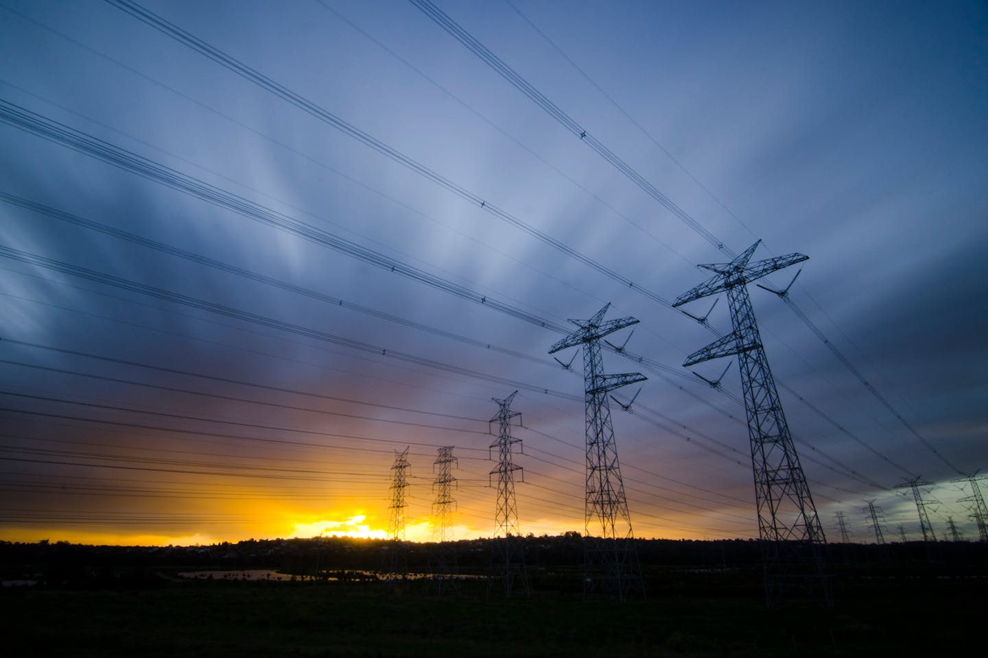 dawn over power lines in australia
