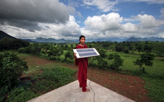 girl in Orissa with solar power