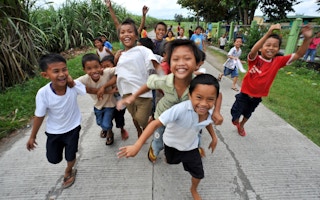 Children play in a street in Davao del Sur, Mindanao, Philippines.