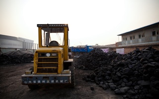 coal at seemingly abandoned construction site in China