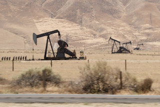Oil rigs in the field beside the interstate