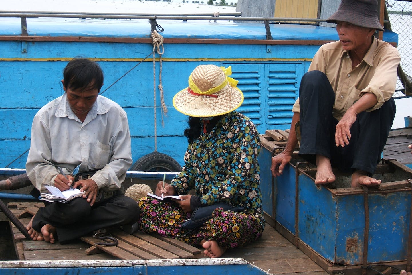 Fishermen in Cambodia balancing their accounts.