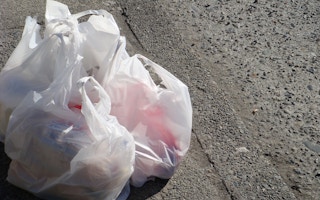 plastic grocery bags on the sidewalk