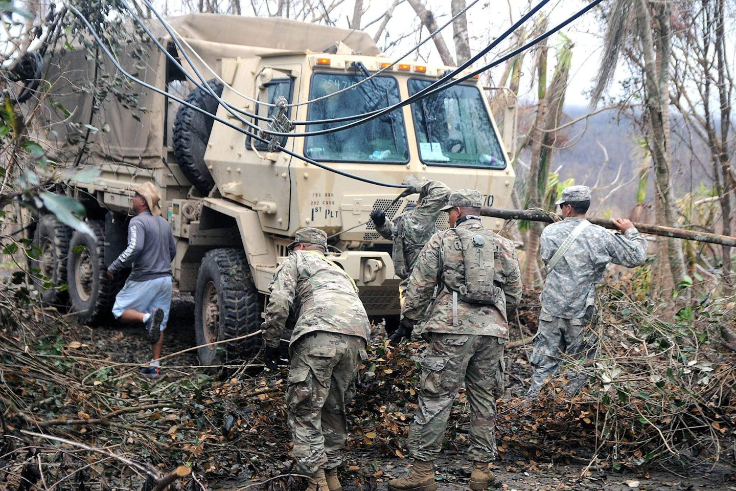The Puerto Rico Army National Guard clearing the roads after Hurricane Maria