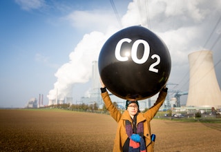 Person protesting against fossil fuel energy stations at COP23