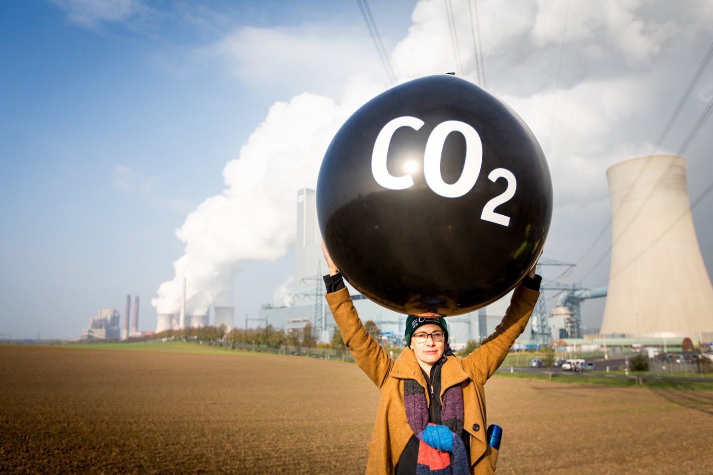 Person protesting against fossil fuel energy stations at COP23