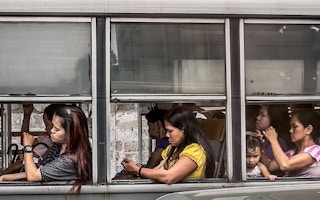 women in a bus Manila