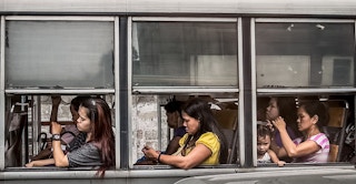 women in a bus Manila