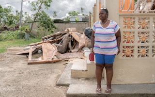 A woman in Loiza at her damaged home in Loíza, Puerto Rico