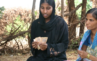 india woman counting money 