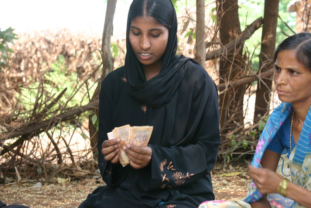 india woman counting money