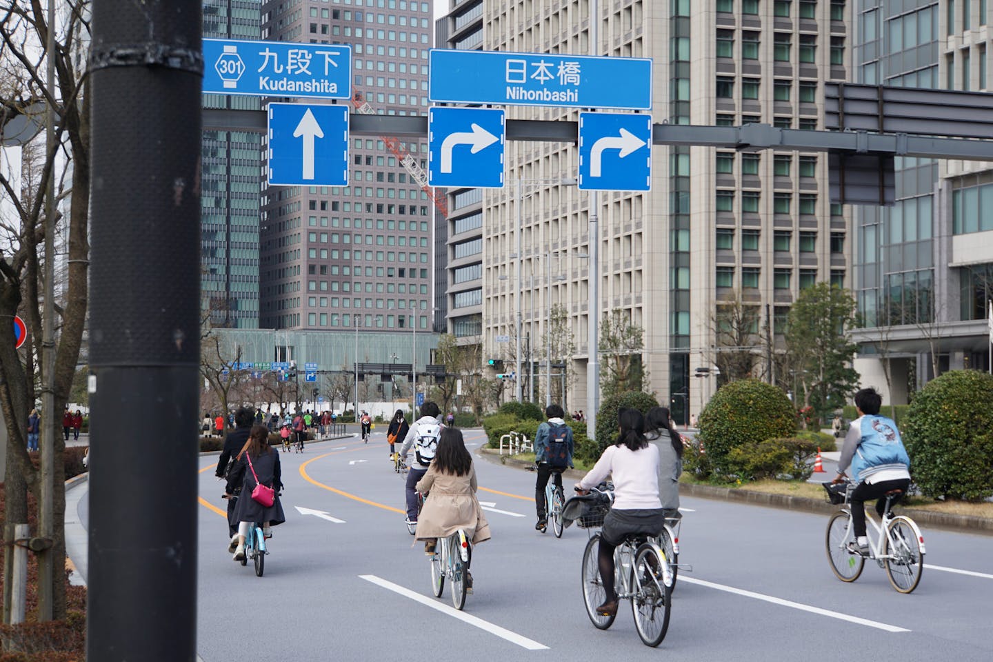 Cyclists on the road in Tokyo, Japan