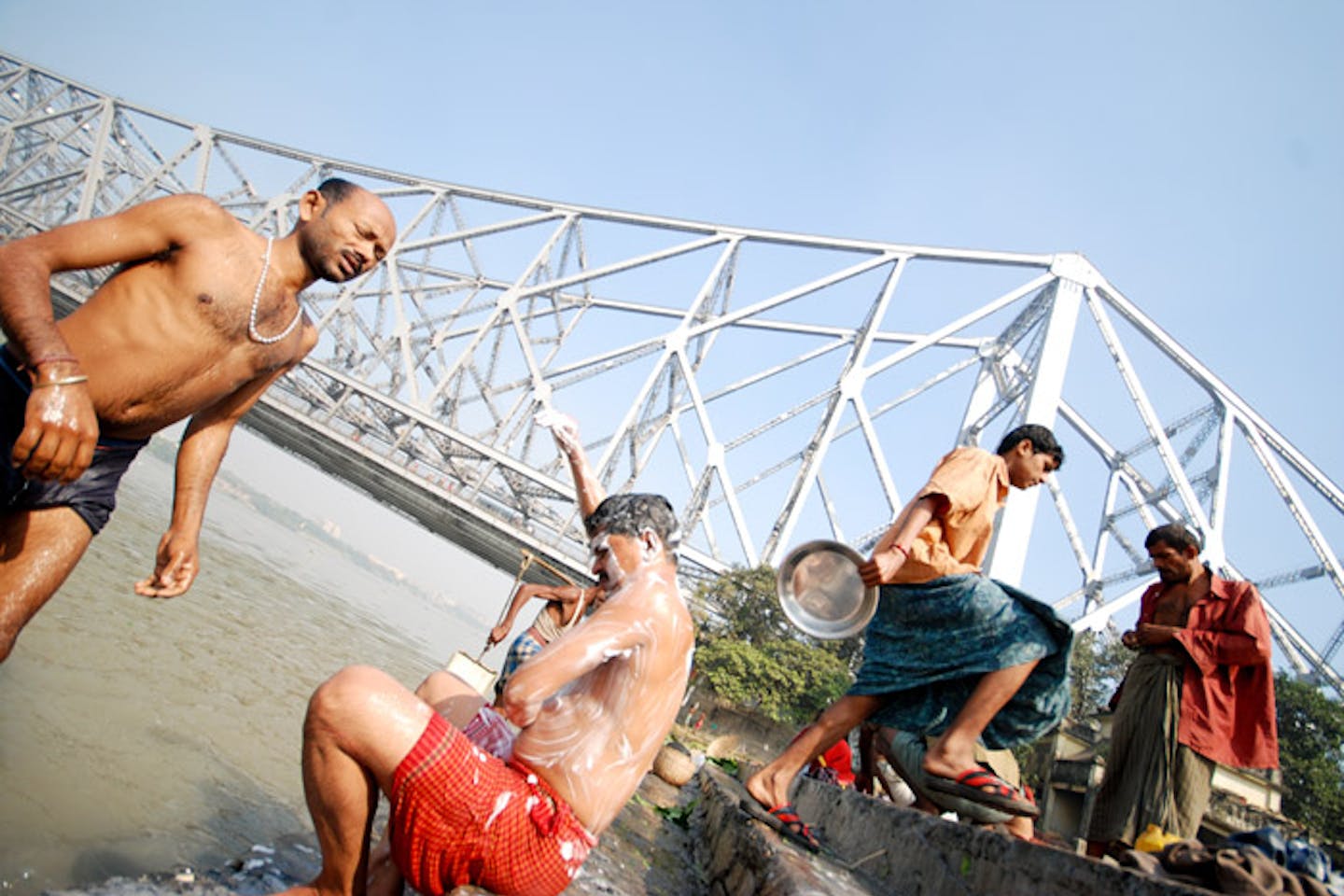 people bathing india water