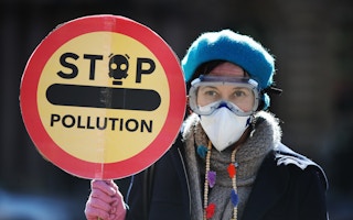 A Friends of the Earth protester objecting to the poor air quality in Glasgow, Scotland