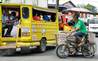 A man sells eggs in a tricycle in Bacolod City, the Philippines