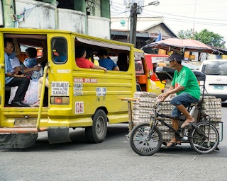 A man sells eggs in a tricycle in Bacolod City, the Philippines