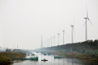 A wind farm beside a river in China