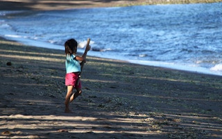 child in the shoreline