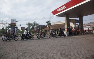 Motorists queue for fuel at a petrol kiosk in Seminyak, Bali.