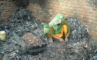 e-waste being processed by hand in India