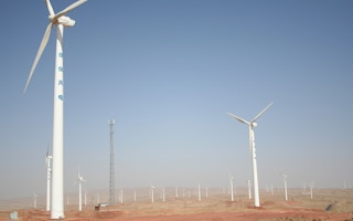 Wind turbines on a solar farm in Ningxia Province in Northern China