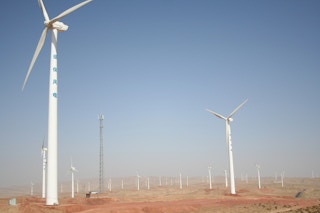 Wind turbines on a solar farm in Ningxia Province in Northern China